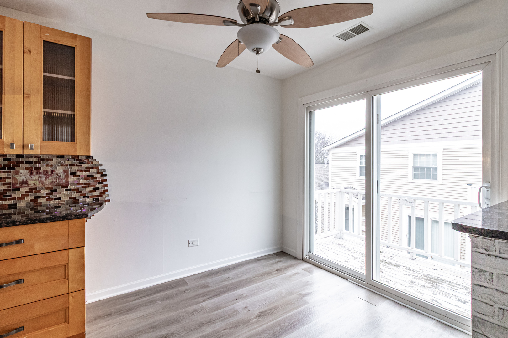 1324 Alpine Court, Unit 1324 Wheeling, IL 60090 - Photo 4 of 12 wooden floor in an empty room with a window
