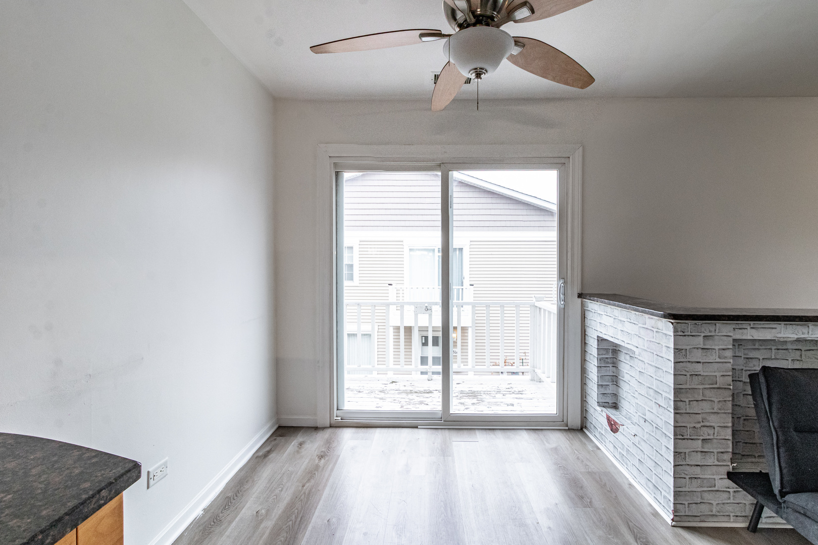 1324 Alpine Court, Unit 1324 Wheeling, IL 60090 - Photo 5 of 12 a view of an empty room with a fireplace and a window