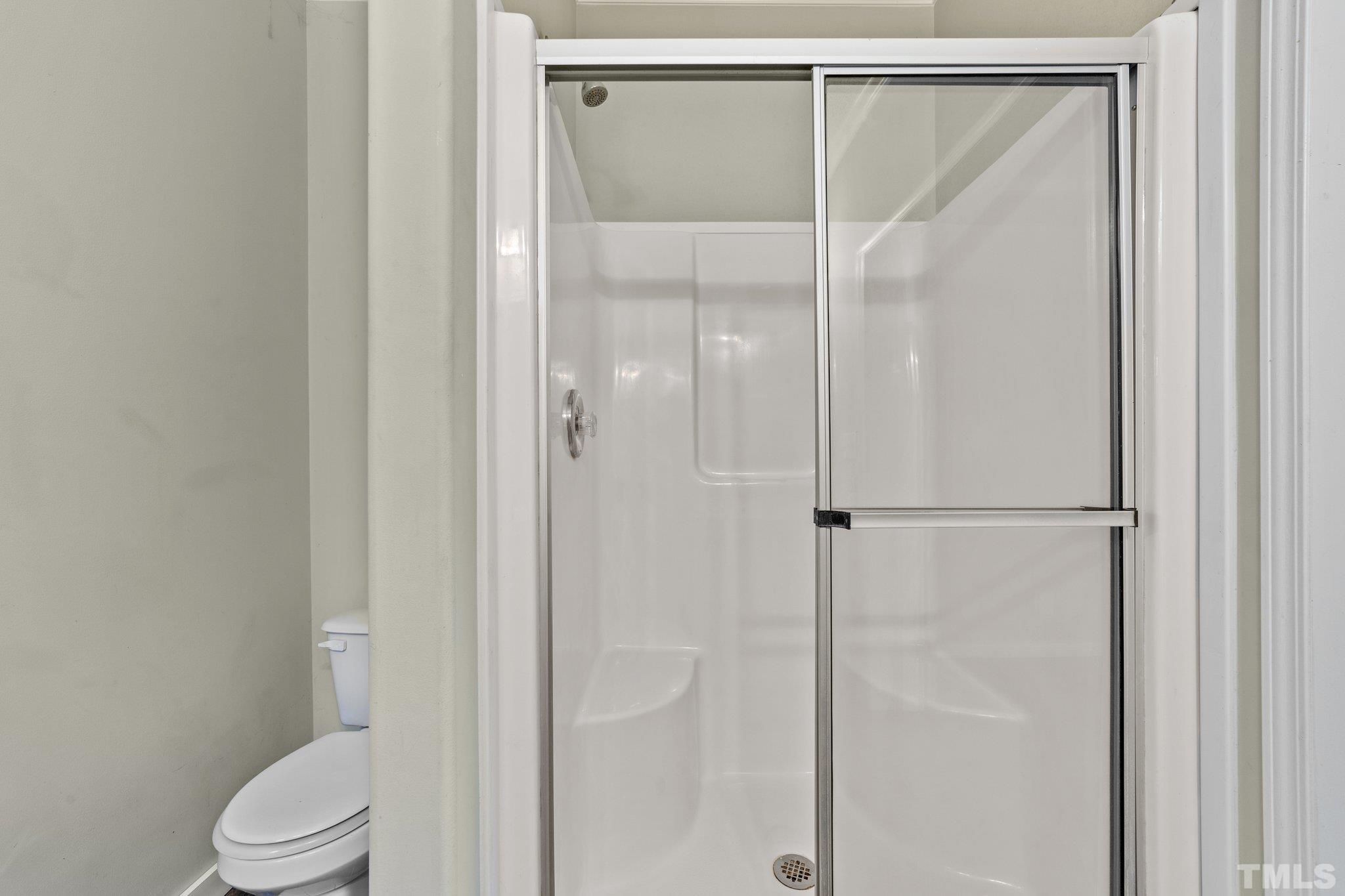 11242 Bissette Road Middlesex, NC 27557 - Photo 21 of 24 a bathroom with a shower and a toilet