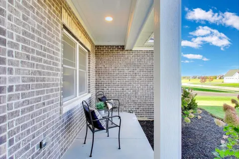 a balcony with wooden floor