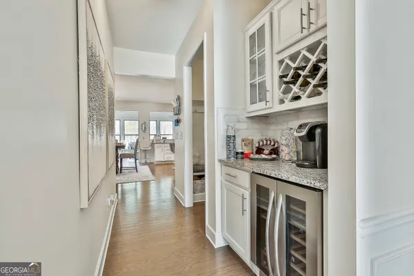 a view of entryway and hall with dining room