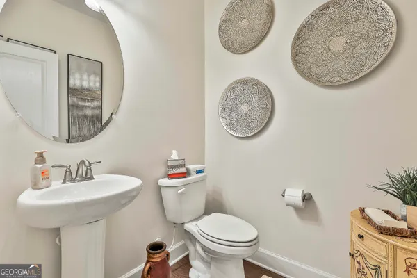 a bedroom with furniture and a chandelier