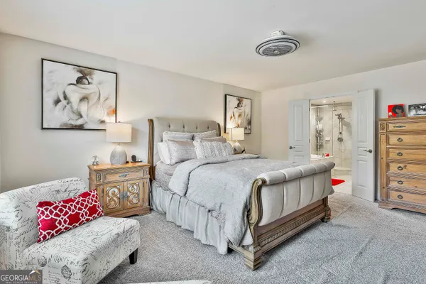 a bathroom with a tub shower vanity and a sink