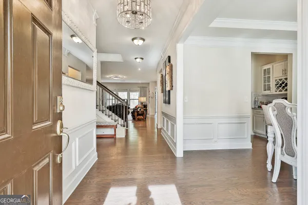 a view of entryway with stairs and wooden floor