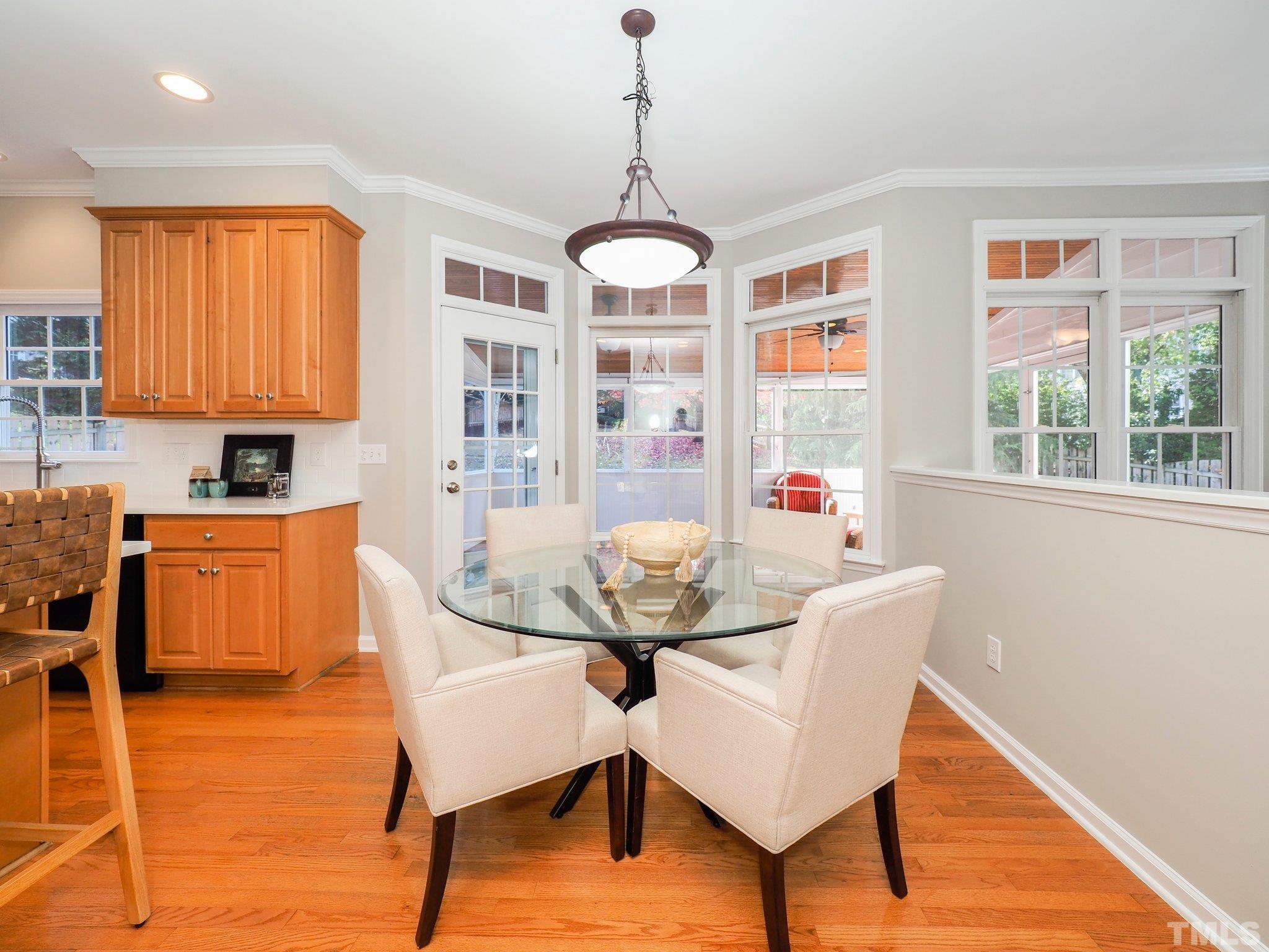703 Haddon Hall Drive Apex, NC 27502 - Photo 13 of 49 a view of a dining room with furniture window and outside view