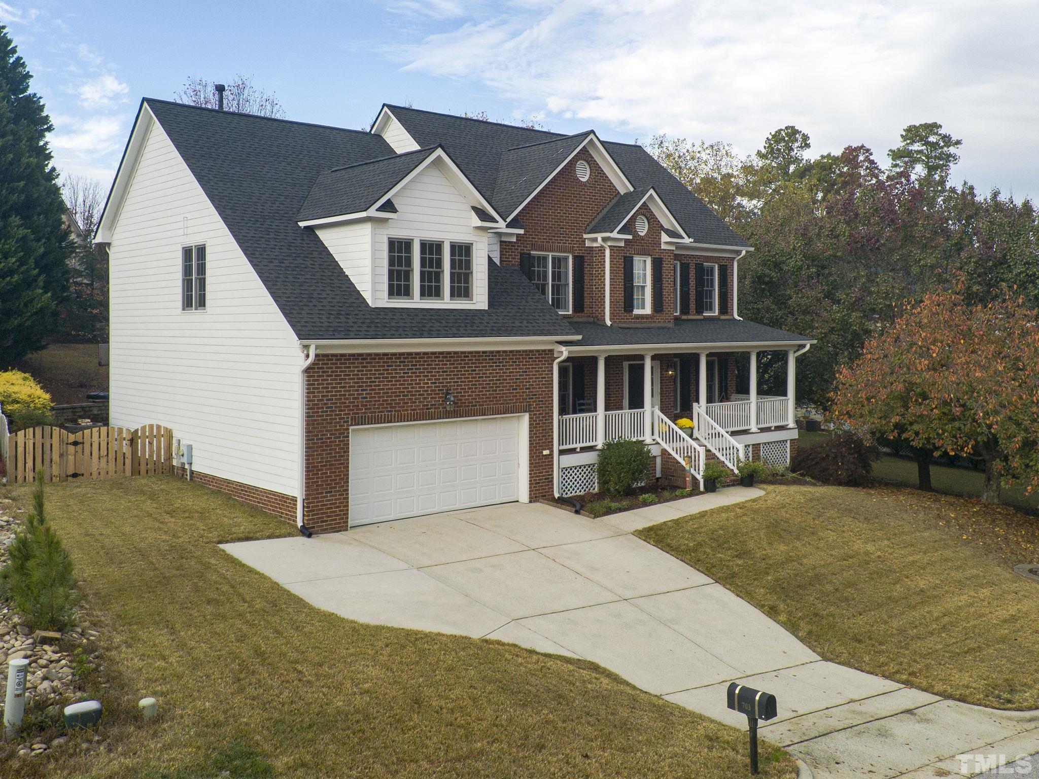 703 Haddon Hall Drive Apex, NC 27502 - Photo 2 of 49 a front view of a house with a yard