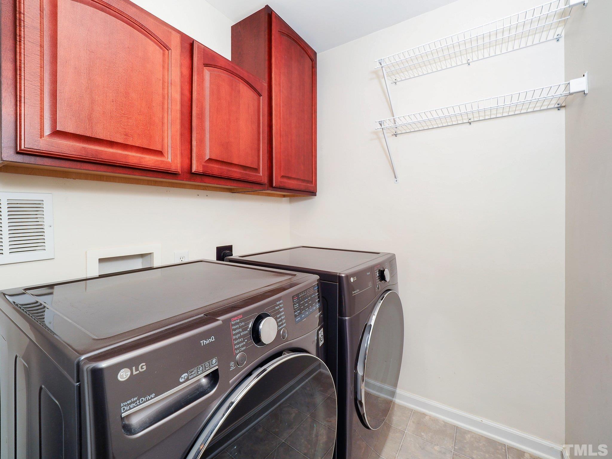 703 Haddon Hall Drive Apex, NC 27502 - Photo 36 of 49 a utility room with dryer and washer