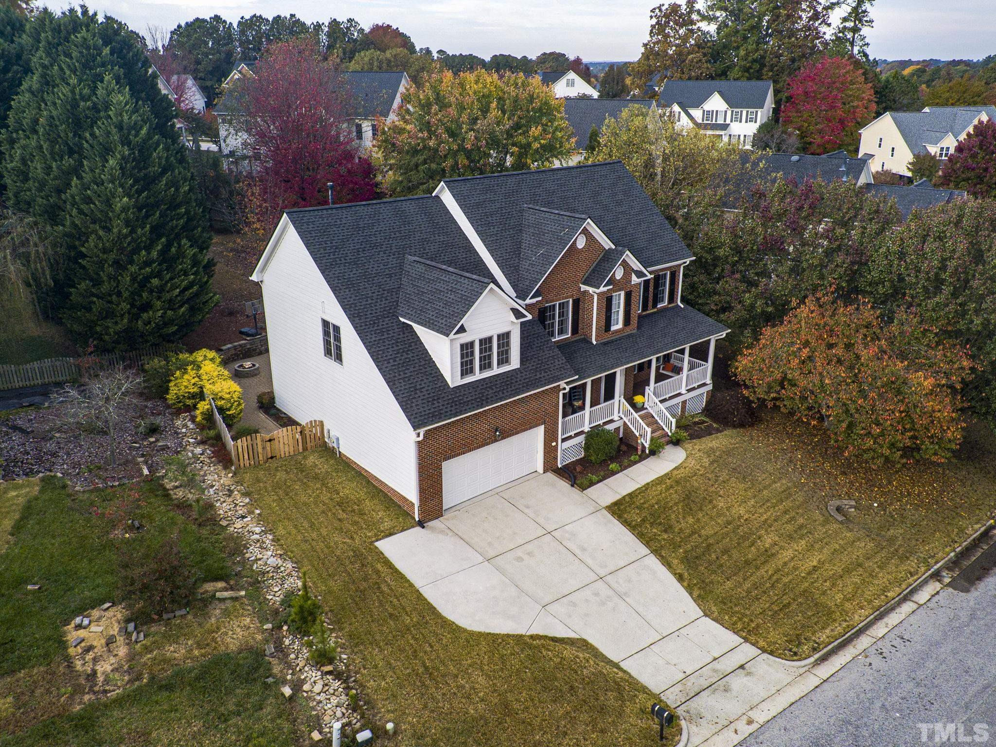 703 Haddon Hall Drive Apex, NC 27502 - Photo 43 of 49 an aerial view of a house with a yard