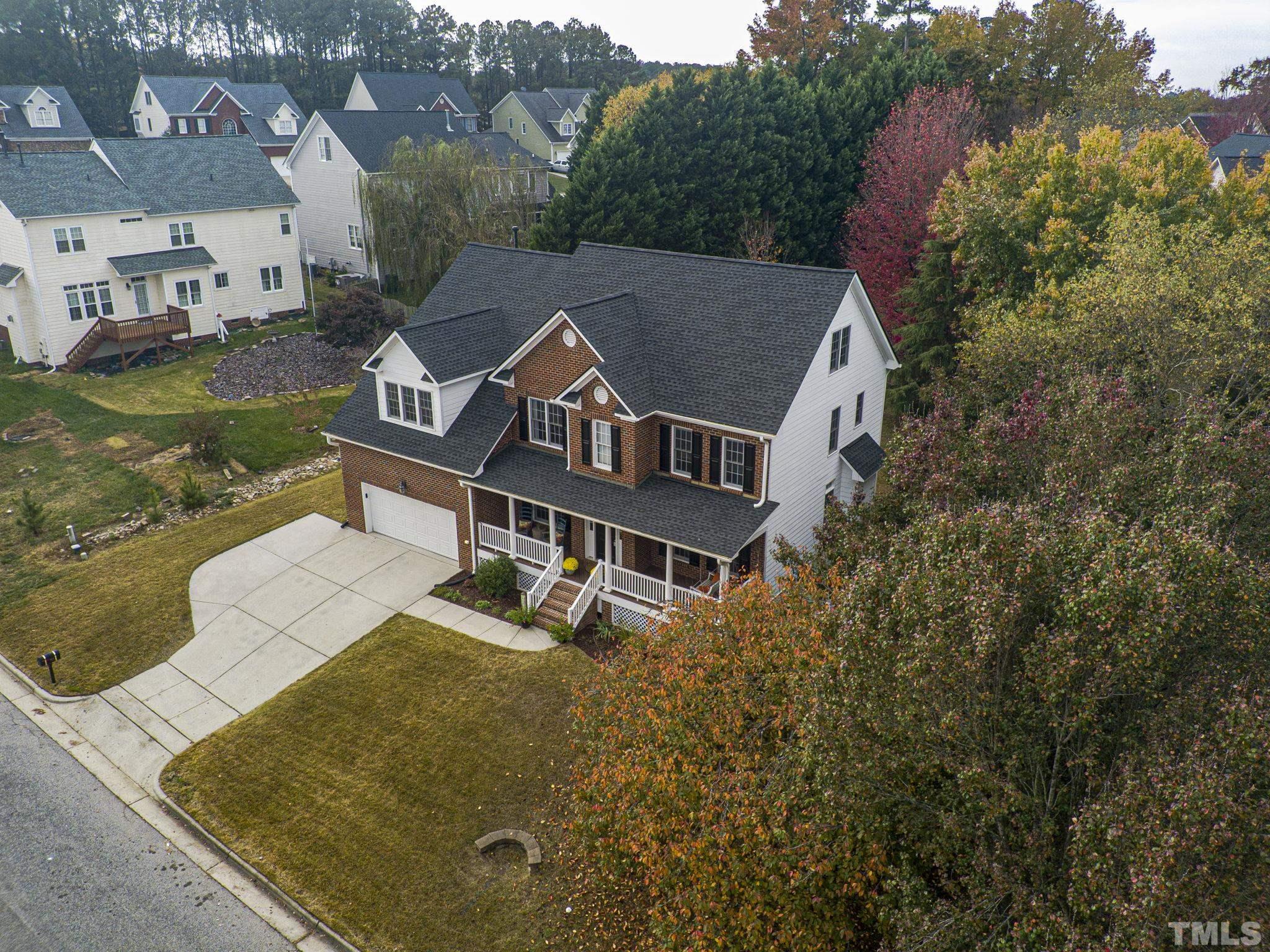 703 Haddon Hall Drive Apex, NC 27502 - Photo 45 of 49 an aerial view of a house with swimming pool