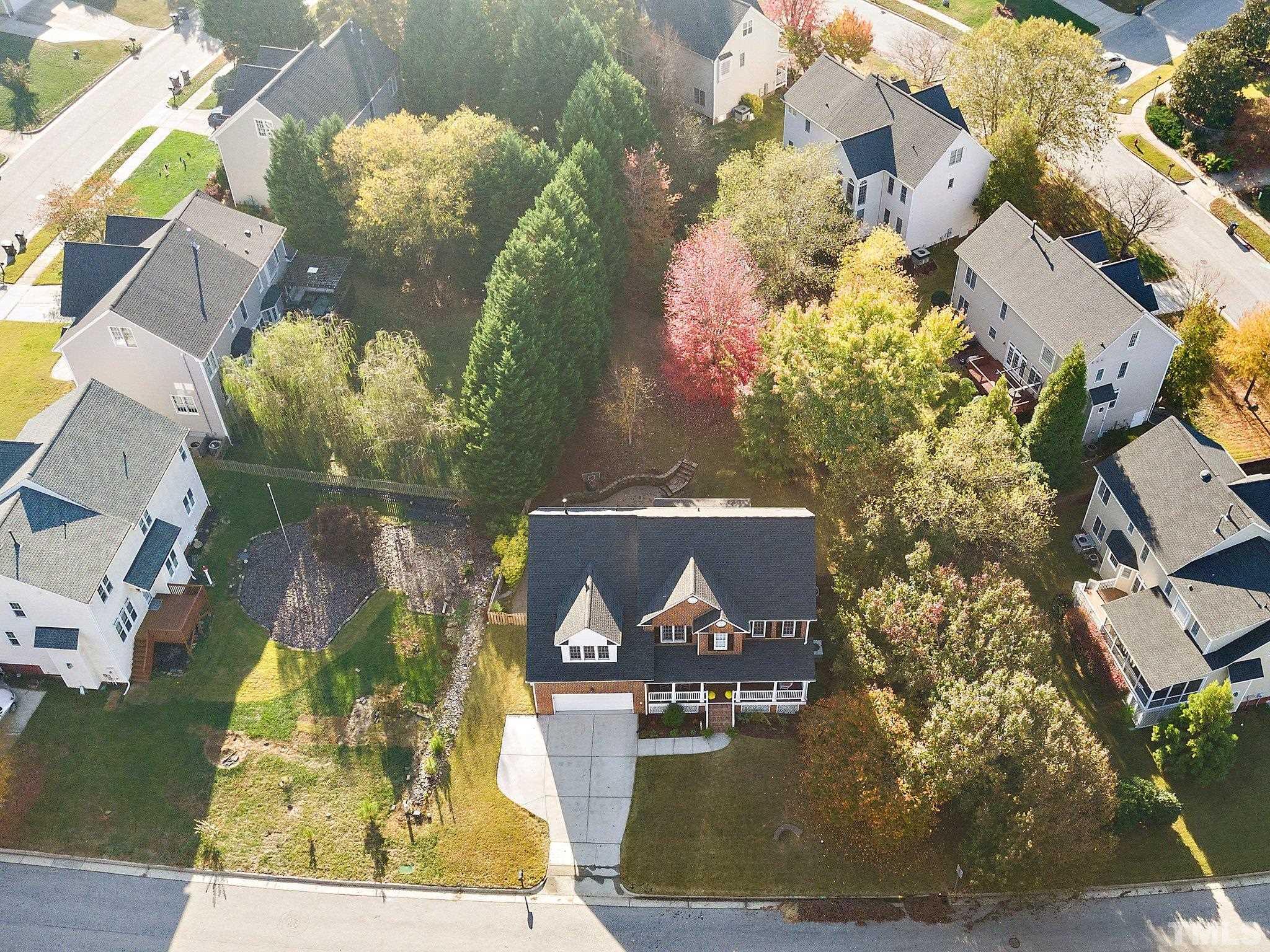 703 Haddon Hall Drive Apex, NC 27502 - Photo 47 of 49 an aerial view of a house with a yard swimming pool and outdoor seating