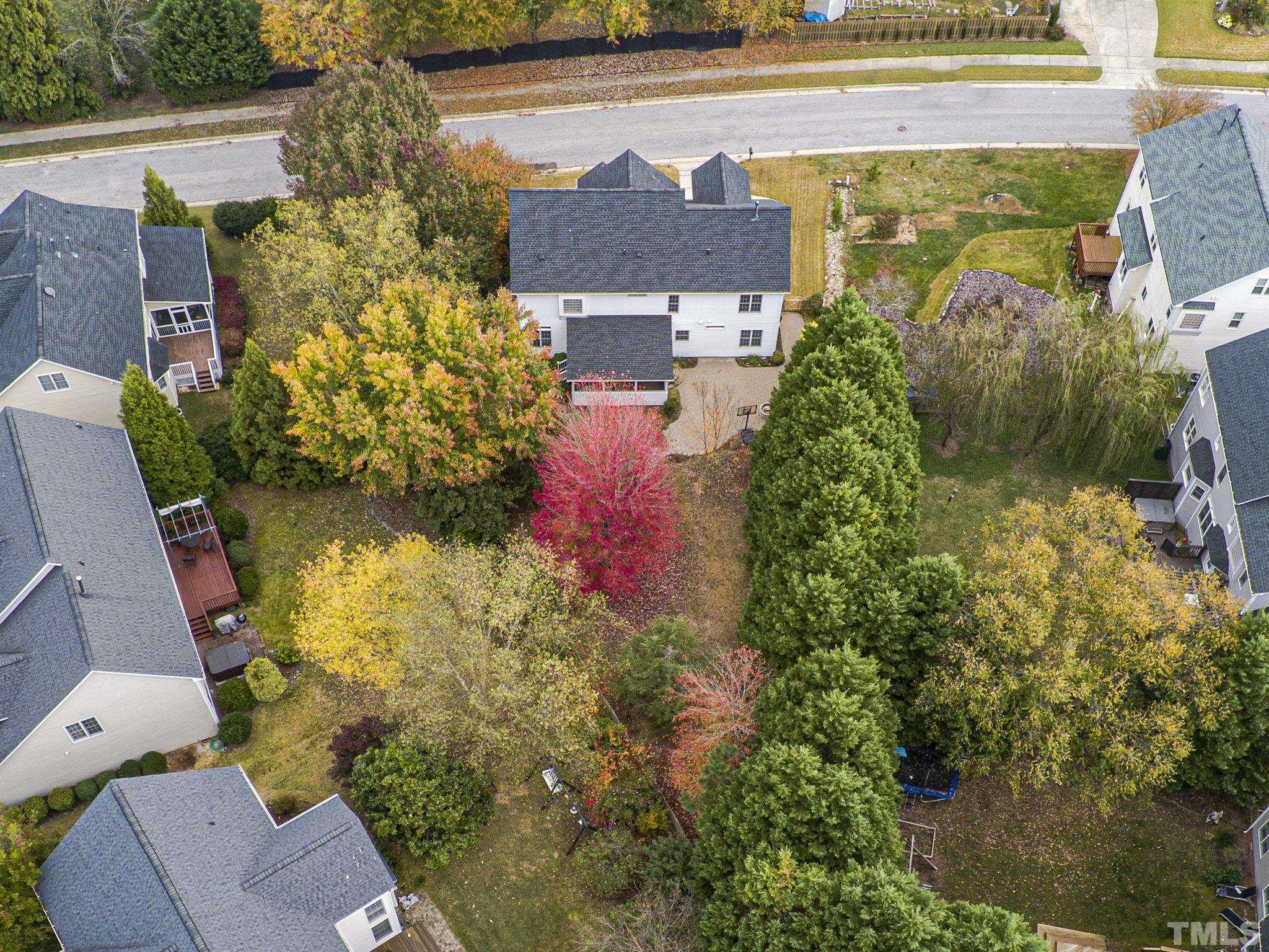 703 Haddon Hall Drive Apex, NC 27502 - Photo 48 of 49 aerial view of a house with a yard and garden