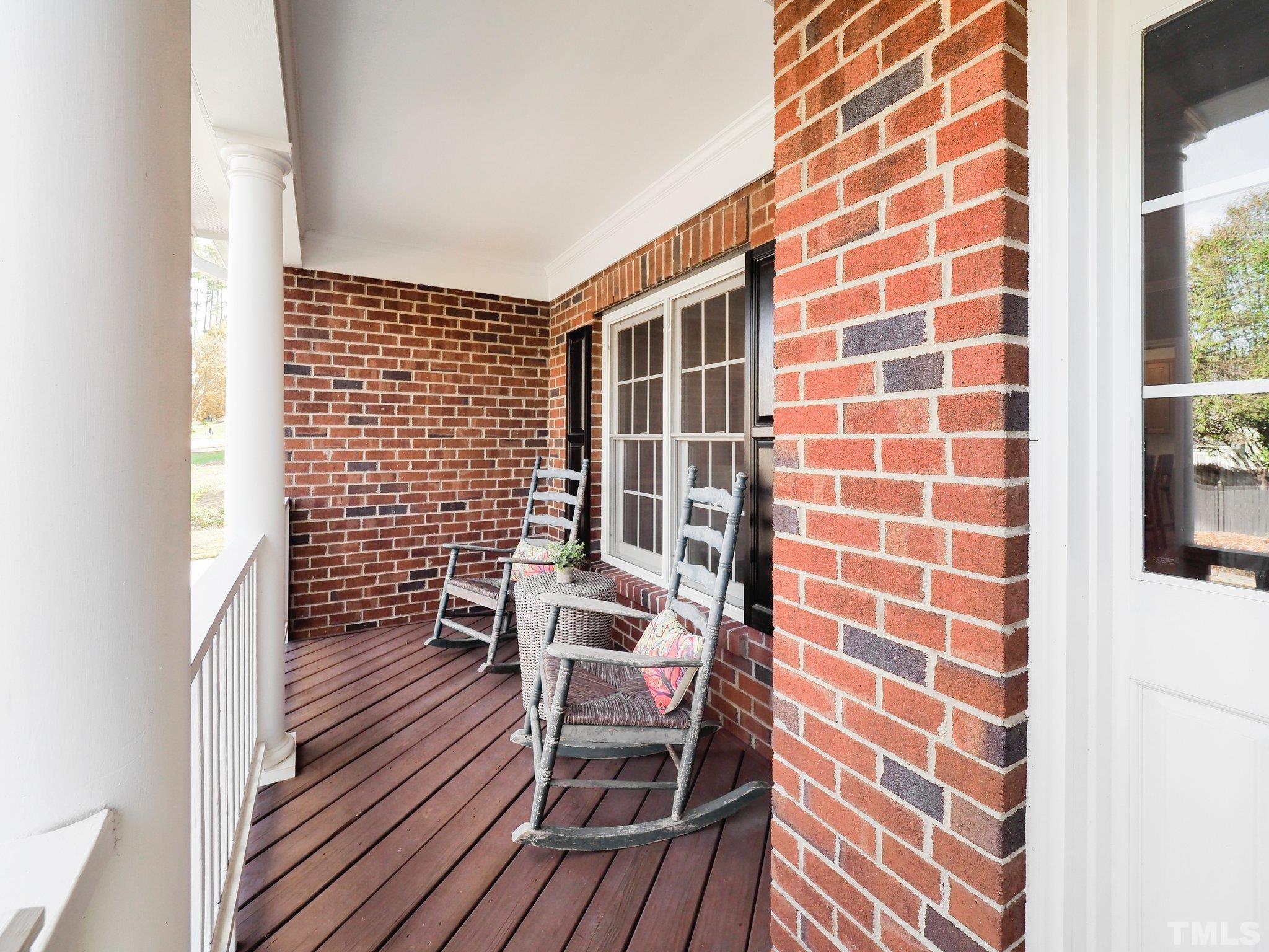 703 Haddon Hall Drive Apex, NC 27502 - Photo 5 of 49 a view of a room with wooden floor and windows