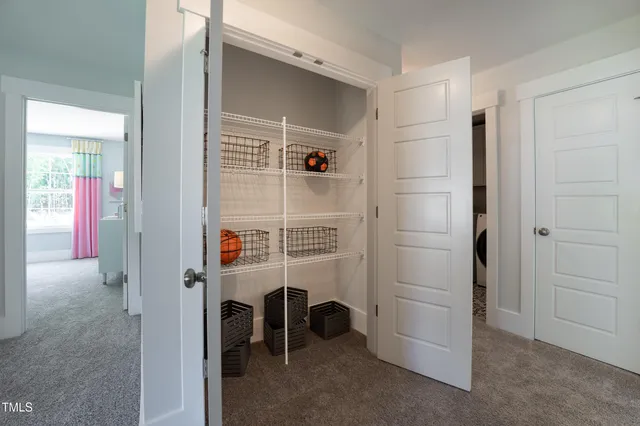 a spacious bathroom with a double vanity sink toilet and shower