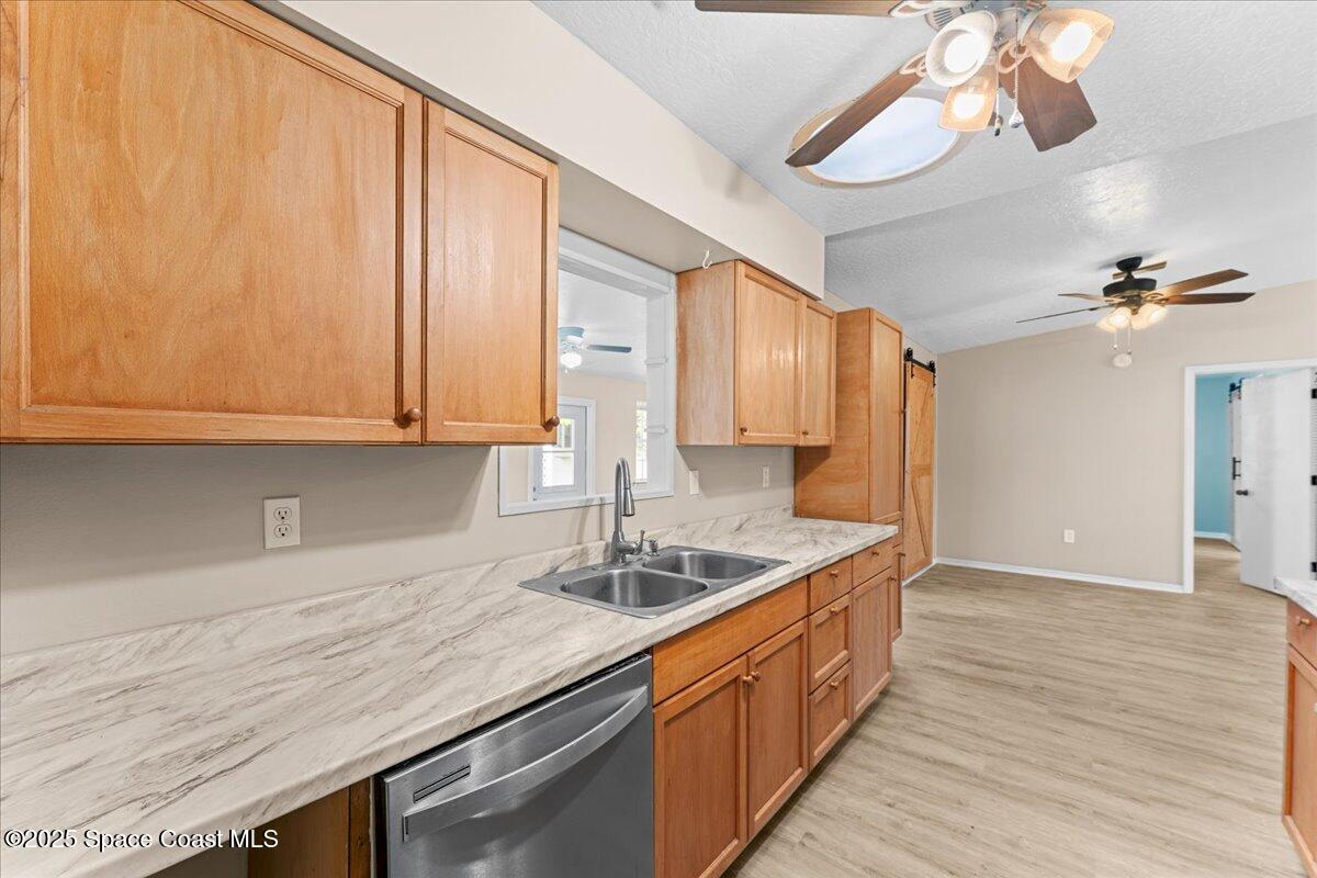 5510 Holden Road Cocoa, FL 32927 - Photo 15 of 51 a kitchen with stainless steel appliances granite countertop a sink a counter space and cabinets