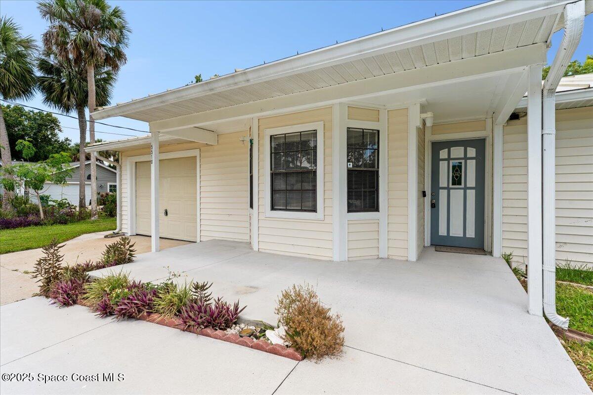 5510 Holden Road Cocoa, FL 32927 - Photo 2 of 51 front view of a house with a yard