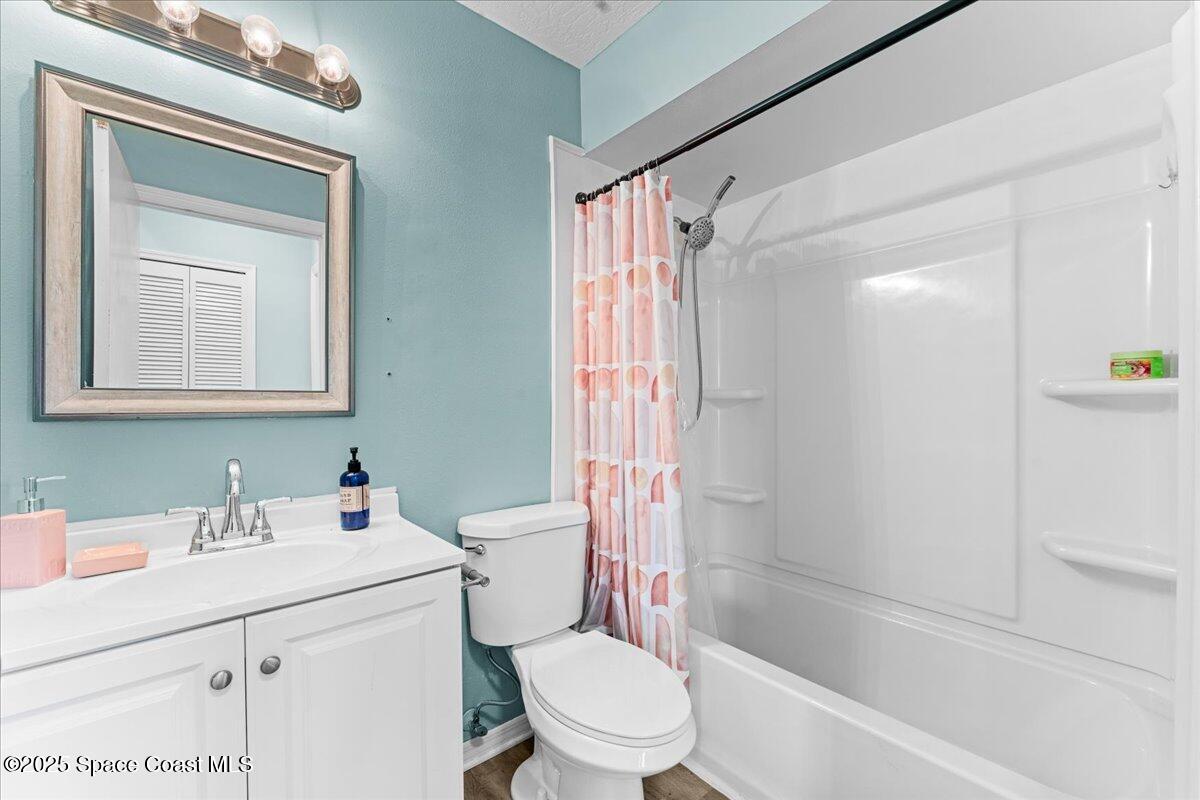 5510 Holden Road Cocoa, FL 32927 - Photo 26 of 51 a bathroom with a sink toilet and shower