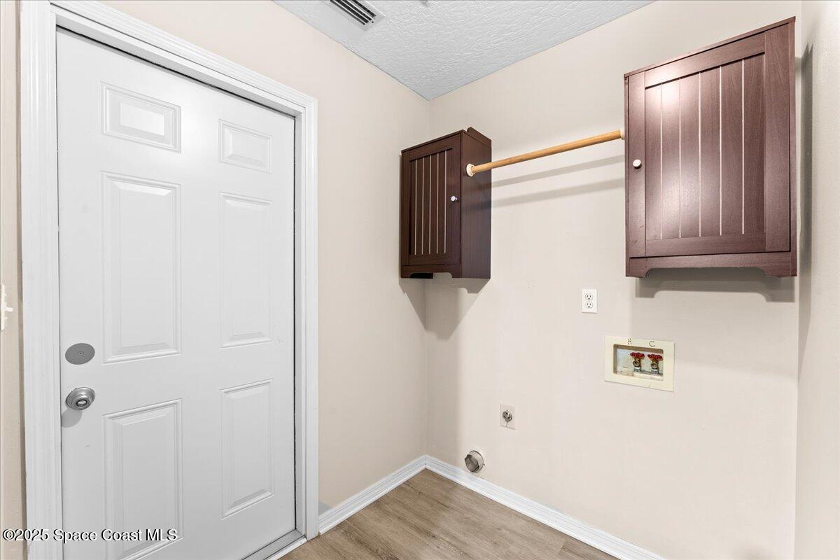 5510 Holden Road Cocoa, FL 32927 - Photo 27 of 51 a view of a livingroom with wooden floor
