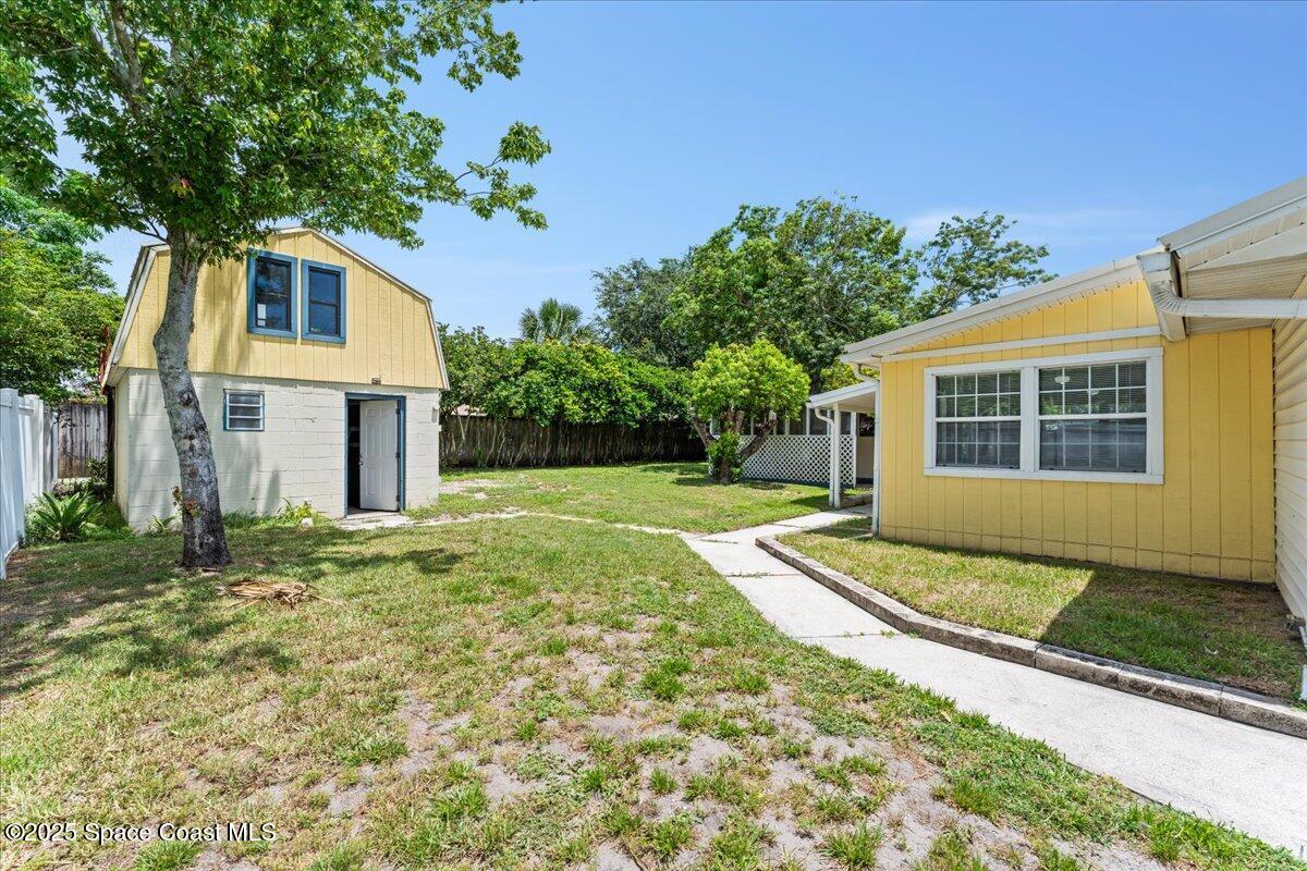 5510 Holden Road Cocoa, FL 32927 - Photo 28 of 51 a house view with a garden space