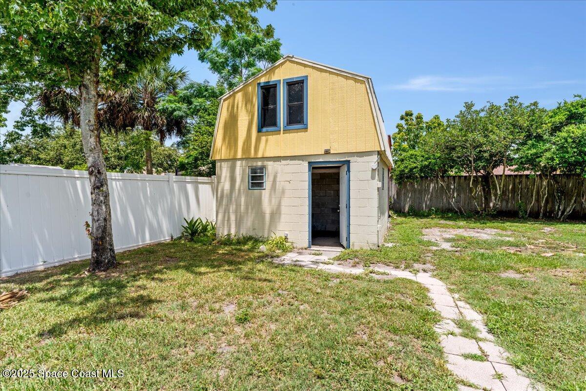 5510 Holden Road Cocoa, FL 32927 - Photo 29 of 51 a front view of a house with a yard