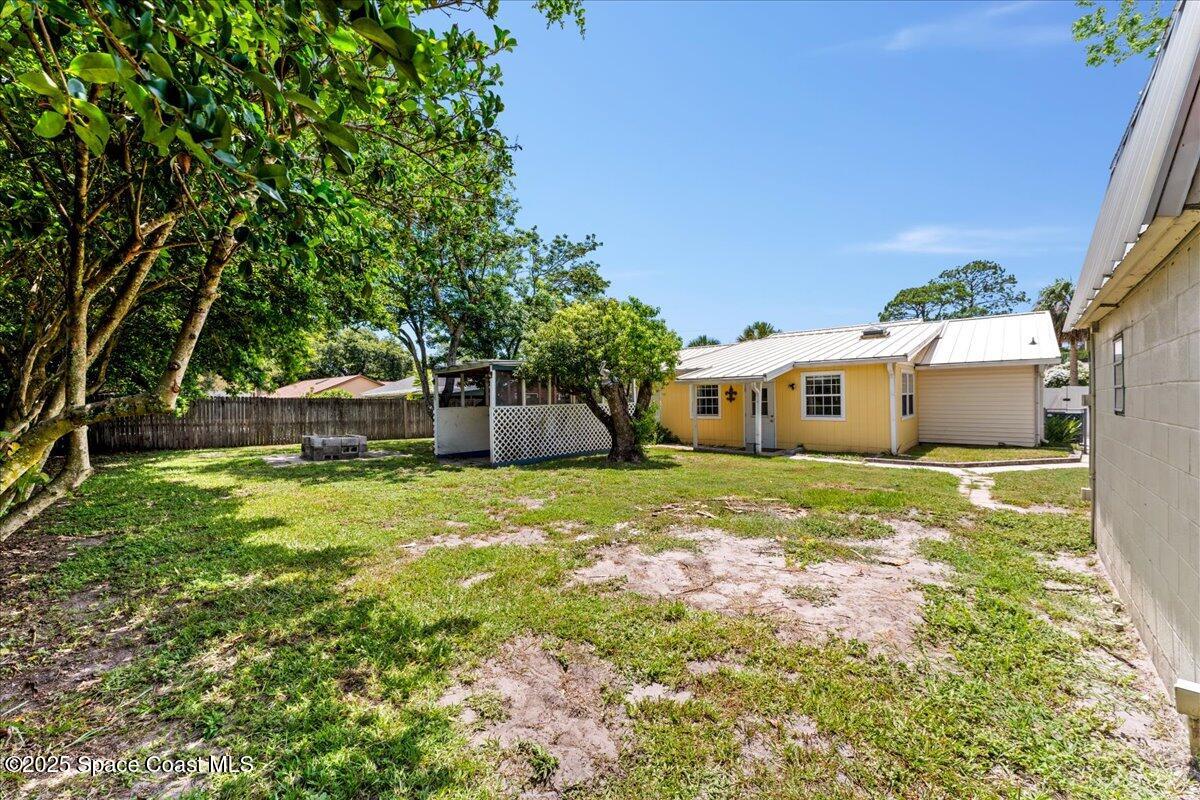 5510 Holden Road Cocoa, FL 32927 - Photo 37 of 51 a front view of a house with a yard