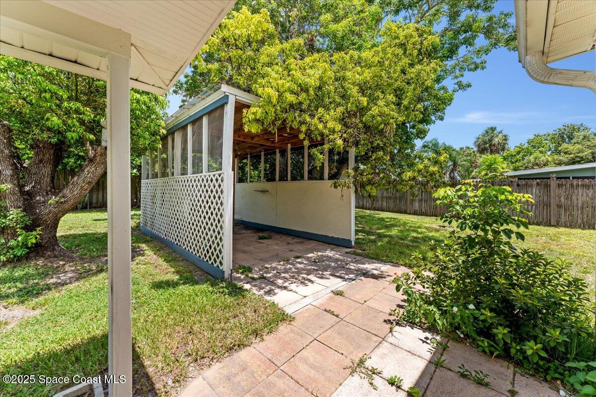 5510 Holden Road Cocoa, FL 32927 - Photo 39 of 51 a front view of a house with a yard