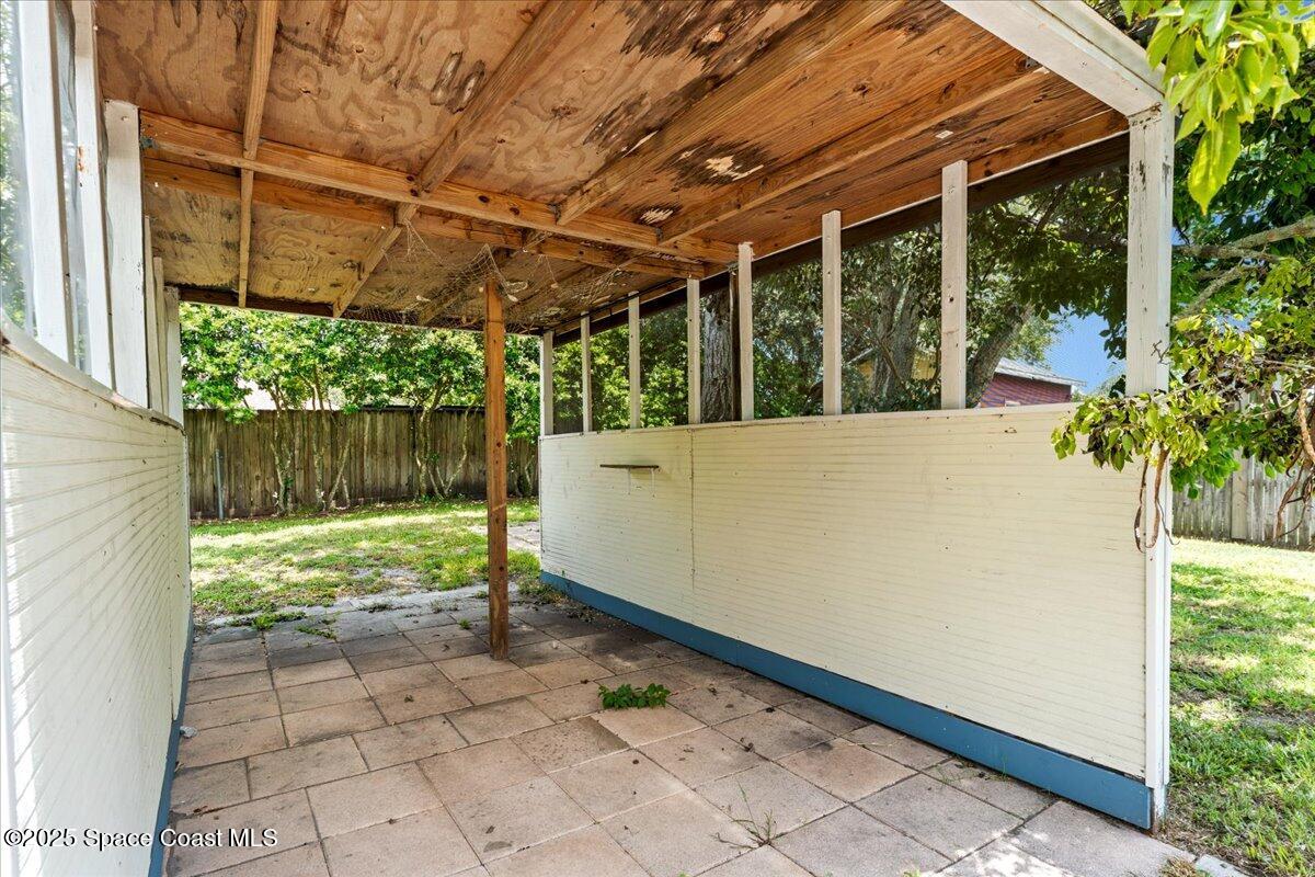 5510 Holden Road Cocoa, FL 32927 - Photo 40 of 51 a view of a backyard with a small cabin