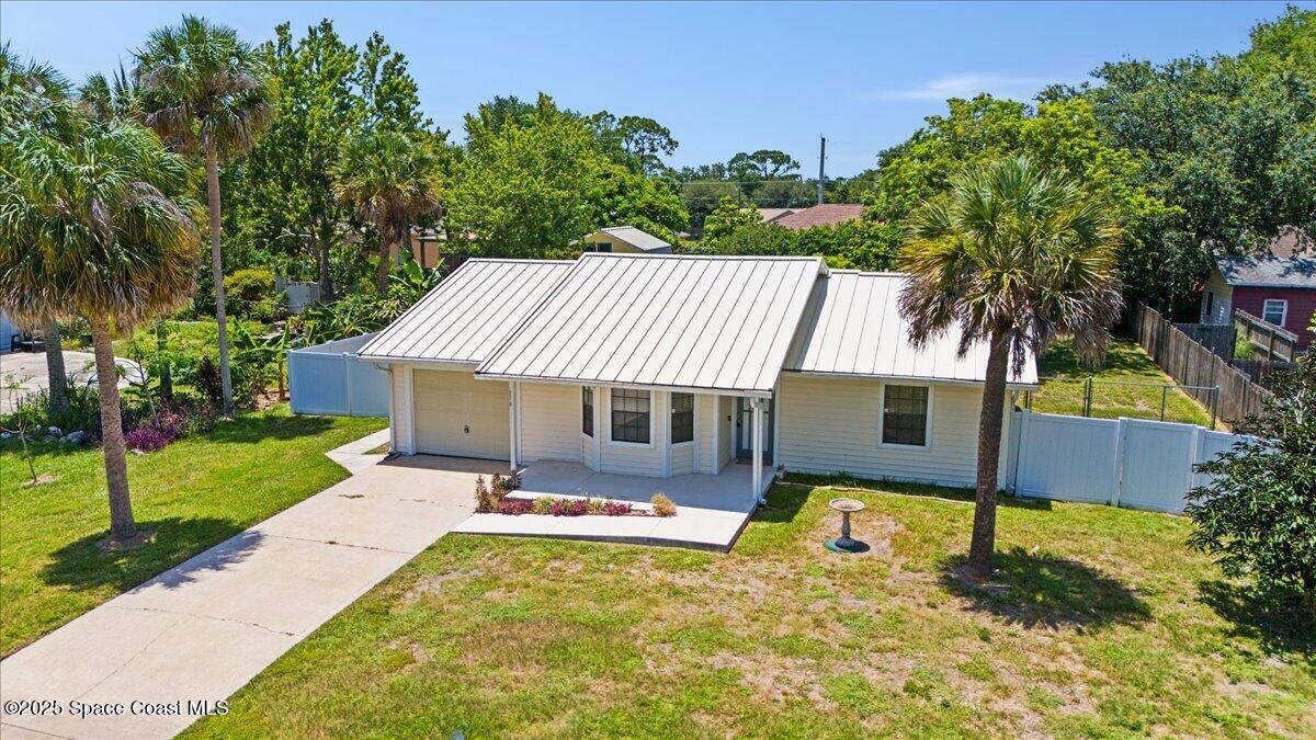 5510 Holden Road Cocoa, FL 32927 - Photo 43 of 51 a view of a backyard with a garden and plants