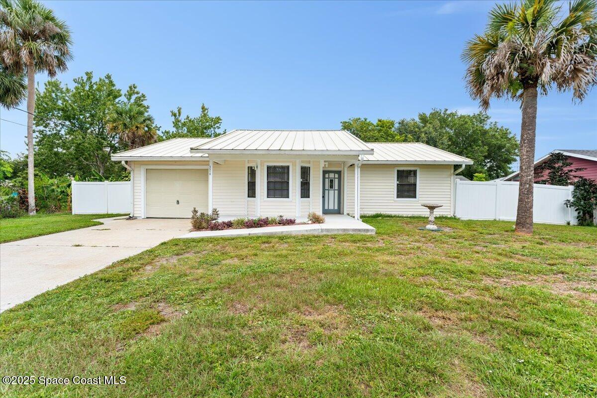 5510 Holden Road Cocoa, FL 32927 - Photo 45 of 51 a front view of a house with a garden