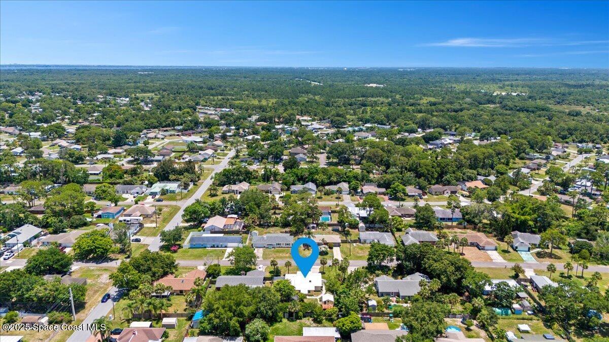 5510 Holden Road Cocoa, FL 32927 - Photo 51 of 51 an aerial view of residential houses with outdoor space and trees