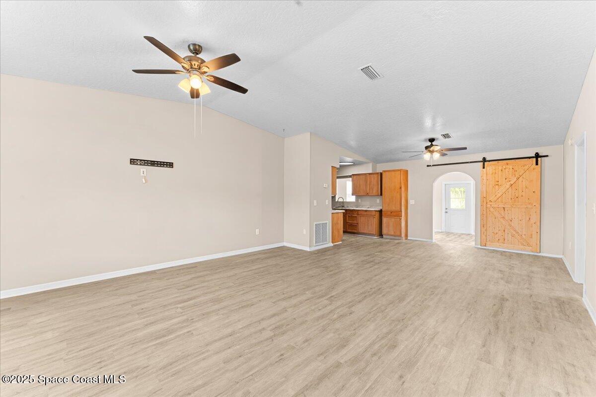 5510 Holden Road Cocoa, FL 32927 - Photo 7 of 51 wooden floor in an empty room