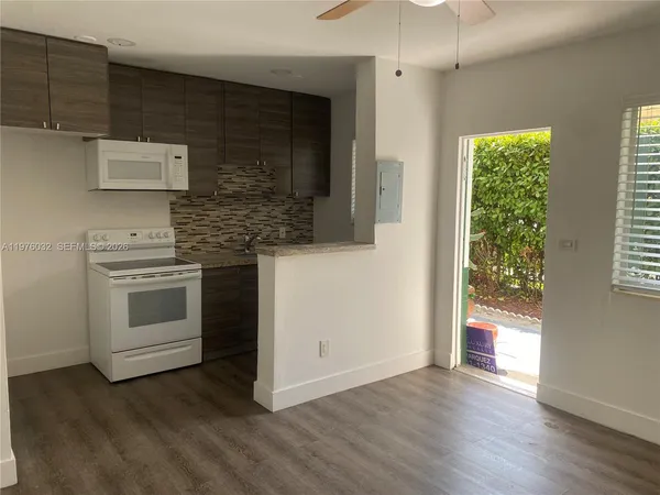 a kitchen with a stove and a microwave