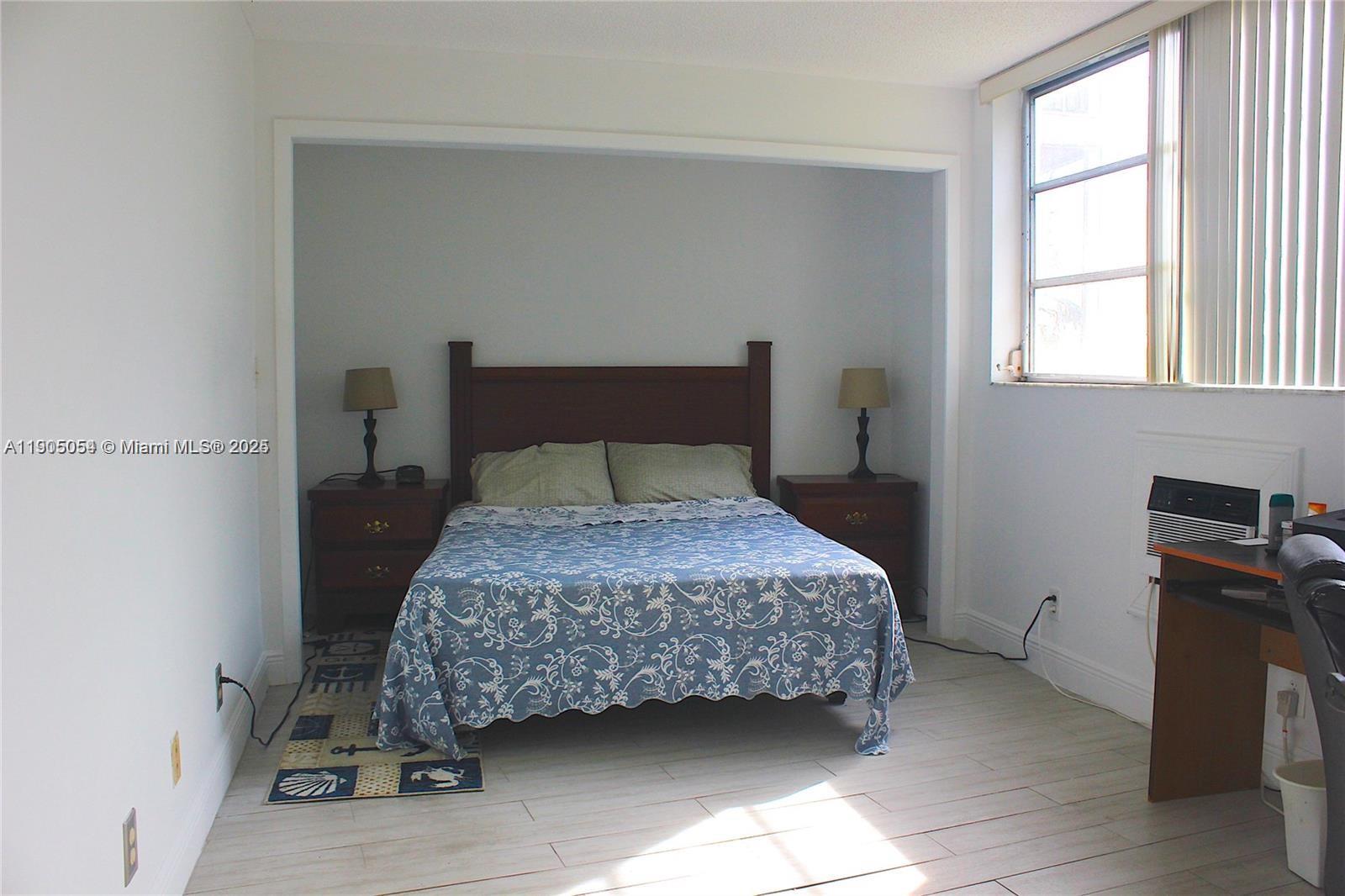 9520 South Hollybrook Lake Drive, Unit 205 Pembroke Pines, FL 33025 - Photo 11 of 22 a bedroom with a bed and a tv