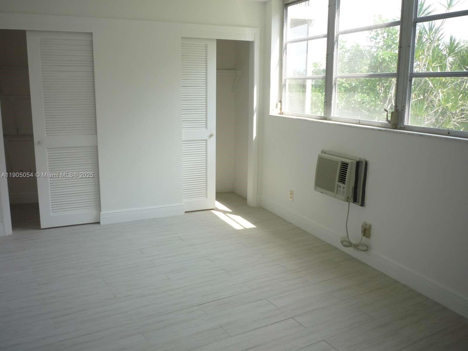 9520 South Hollybrook Lake Drive, Unit 205 Pembroke Pines, FL 33025 - Photo 12 of 22 an empty room with a window