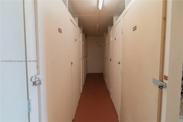 a view of a hallway with a door