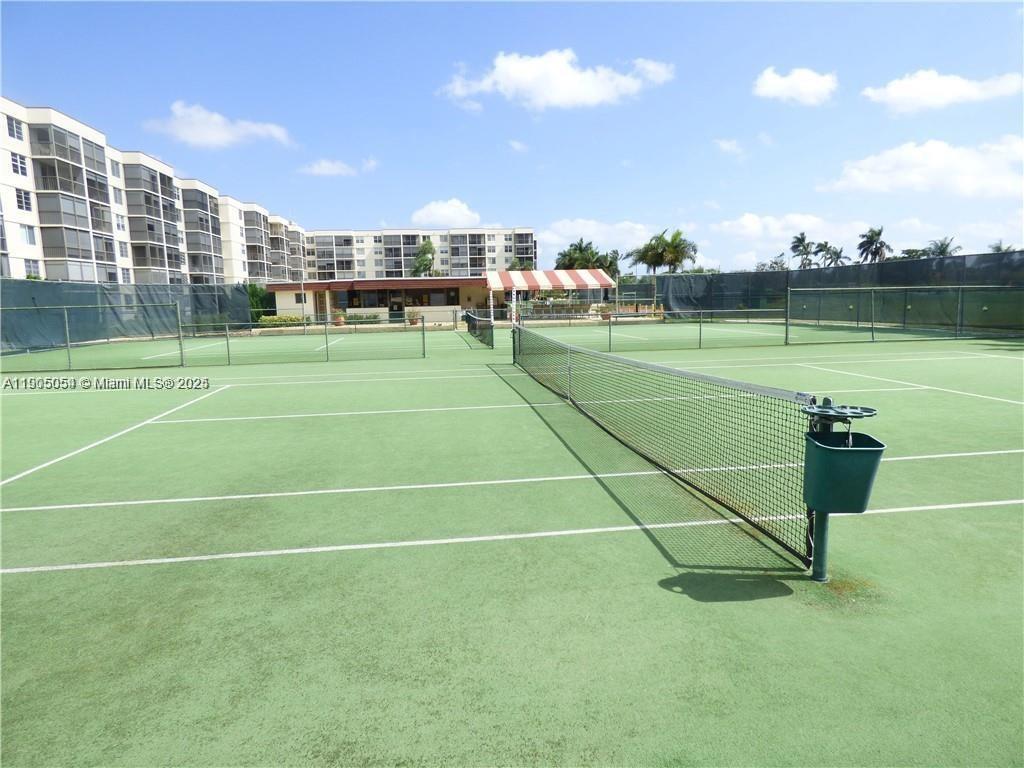 9520 South Hollybrook Lake Drive, Unit 205 Pembroke Pines, FL 33025 - Photo 20 of 22 a view of a tennis court