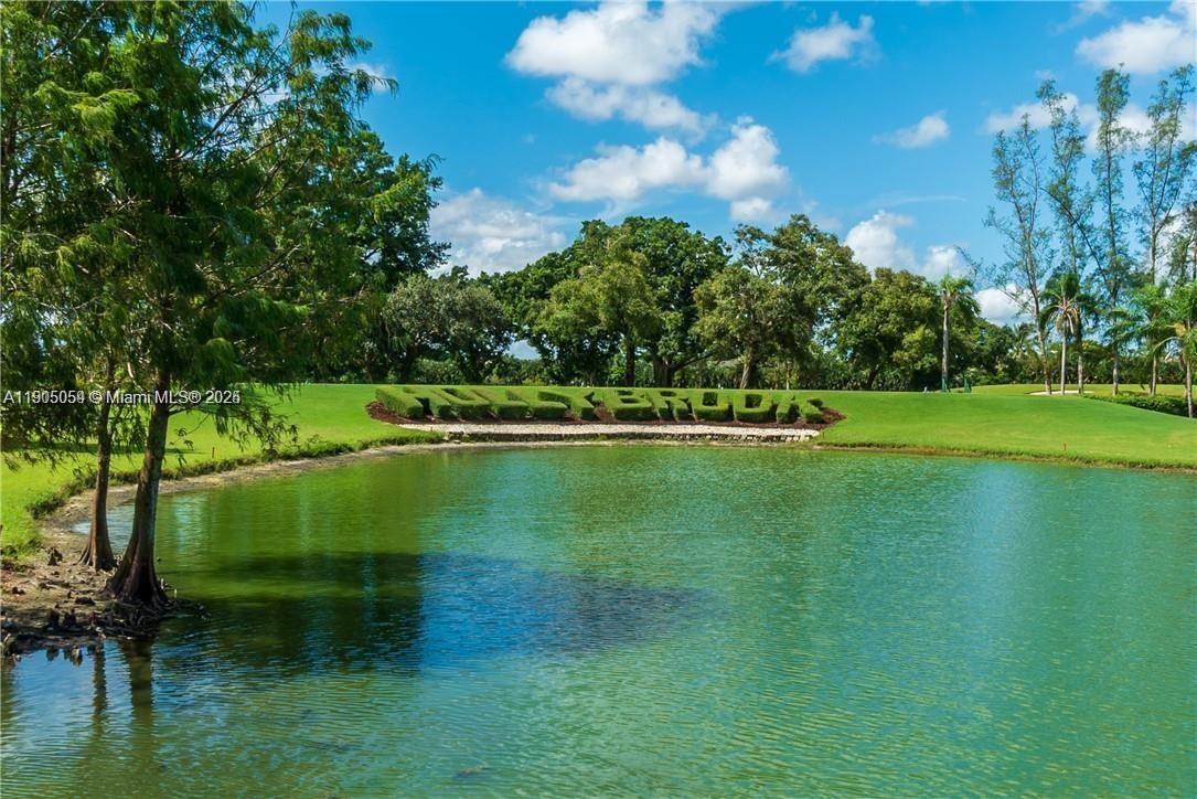 9520 South Hollybrook Lake Drive, Unit 205 Pembroke Pines, FL 33025 - Photo 22 of 22 a view of a golf course with a lake