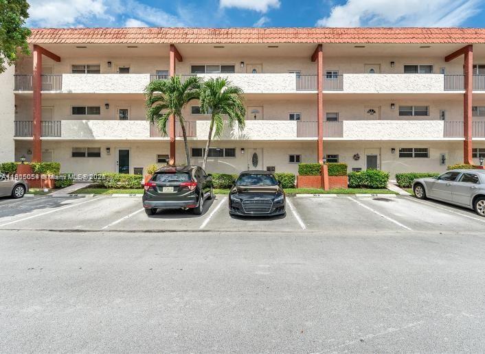 9520 South Hollybrook Lake Drive, Unit 205 Pembroke Pines, FL 33025 - Photo 3 of 22 a cars parked in front of a building