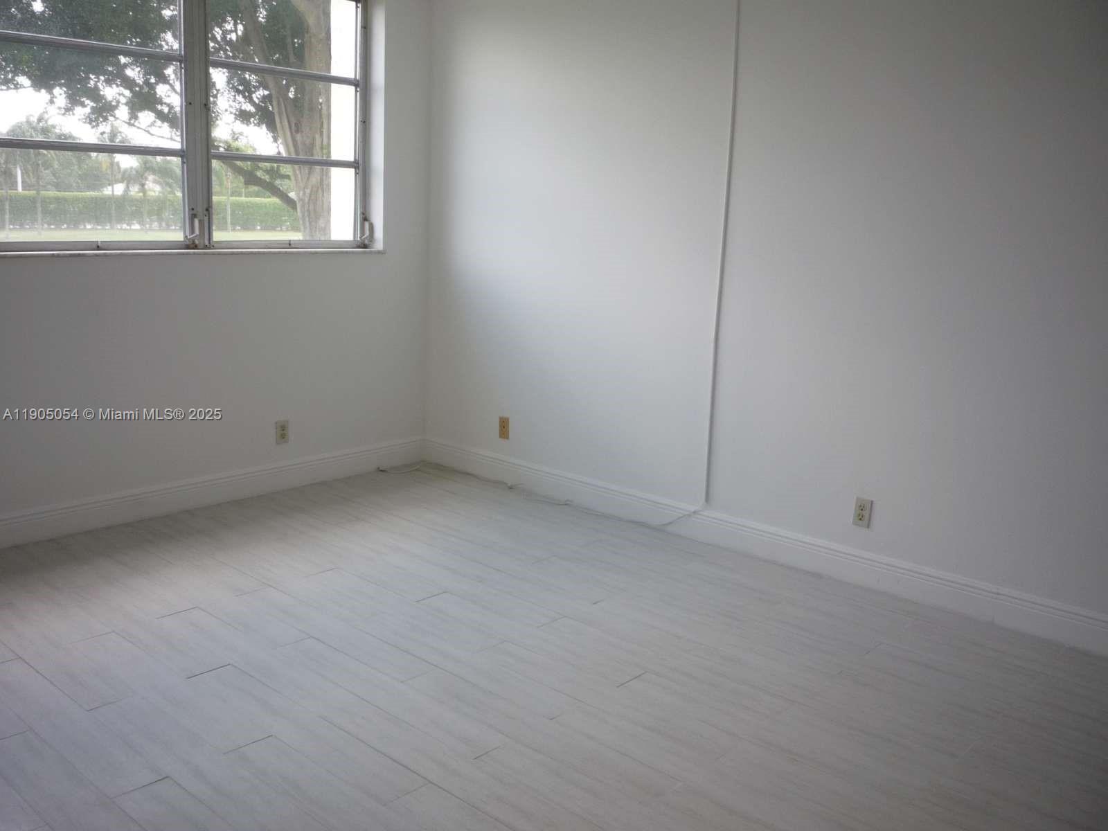 9520 South Hollybrook Lake Drive, Unit 205 Pembroke Pines, FL 33025 - Photo 8 of 22 a view of an empty room with a window