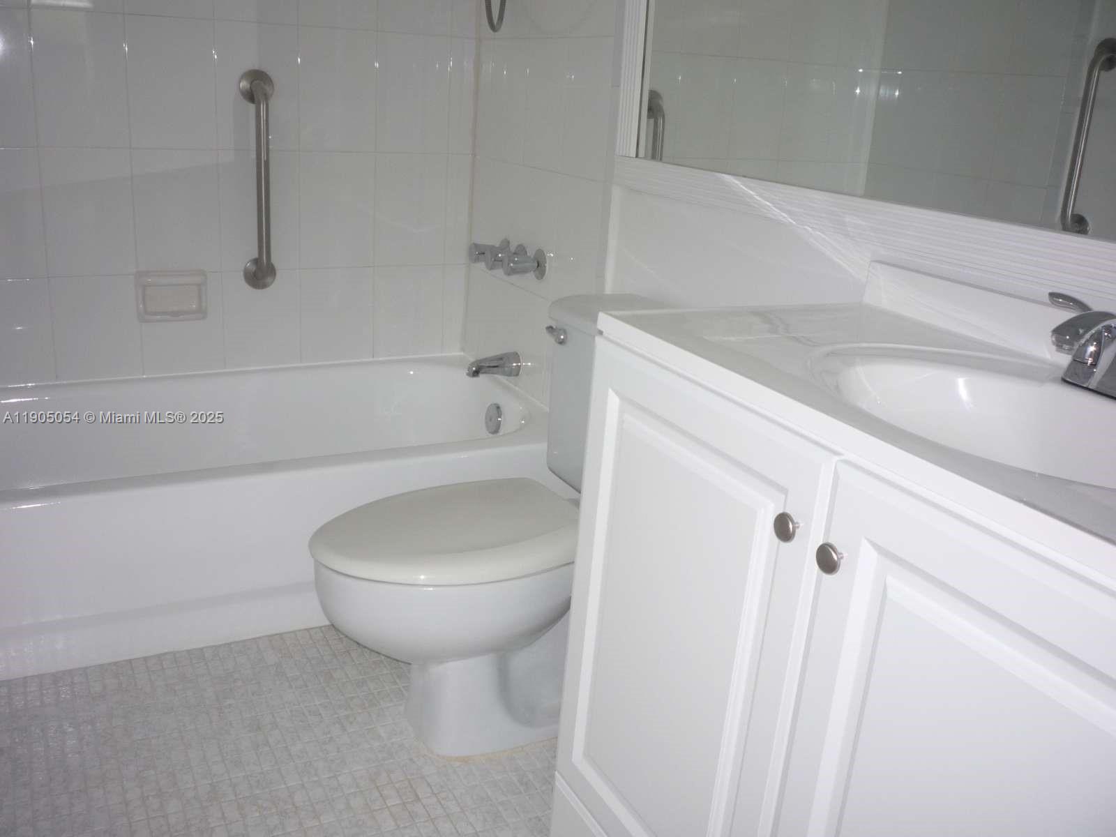 9520 South Hollybrook Lake Drive, Unit 205 Pembroke Pines, FL 33025 - Photo 10 of 22 a bathroom with a sink a toilet and bathtub