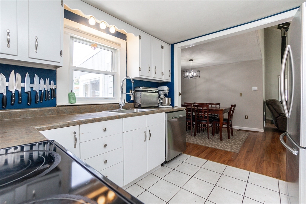 67 West Shore Road Holbrook, MA 02343 - Photo 11 of 42 a kitchen with stainless steel appliances granite countertop a refrigerator and a sink