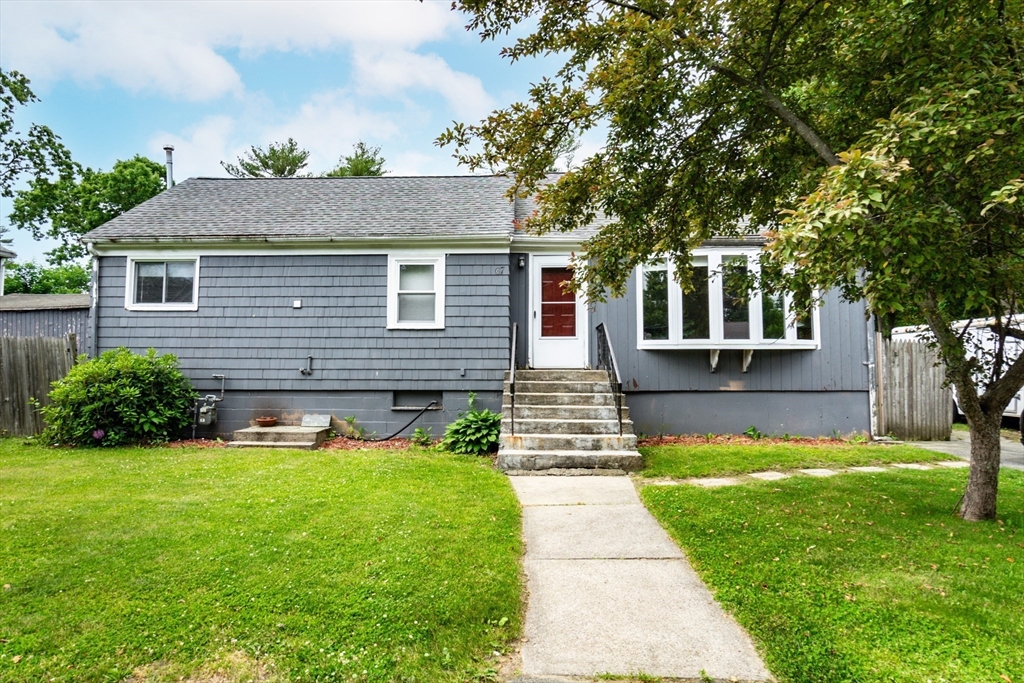 67 West Shore Road Holbrook, MA 02343 - Photo 40 of 42 a front view of a house with yard and green space