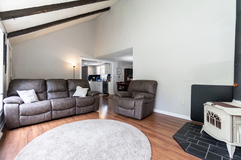67 West Shore Road Holbrook, MA 02343 - Photo 4 of 42 a living room with furniture and a wooden floor