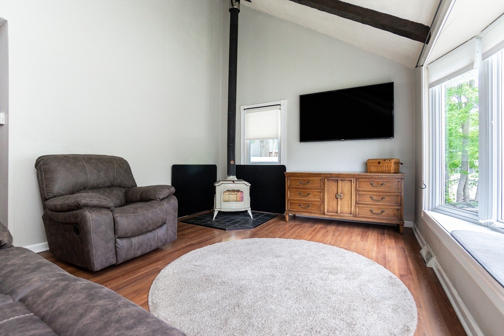 67 West Shore Road Holbrook, MA 02343 - Photo 6 of 42 a living room with furniture and a flat screen tv