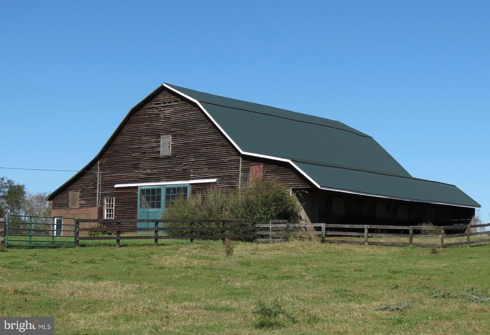 12036 Crest Hill Road Hume, VA 22639 - Photo 25 of 30 Large barn, stalls to right side, center aisle