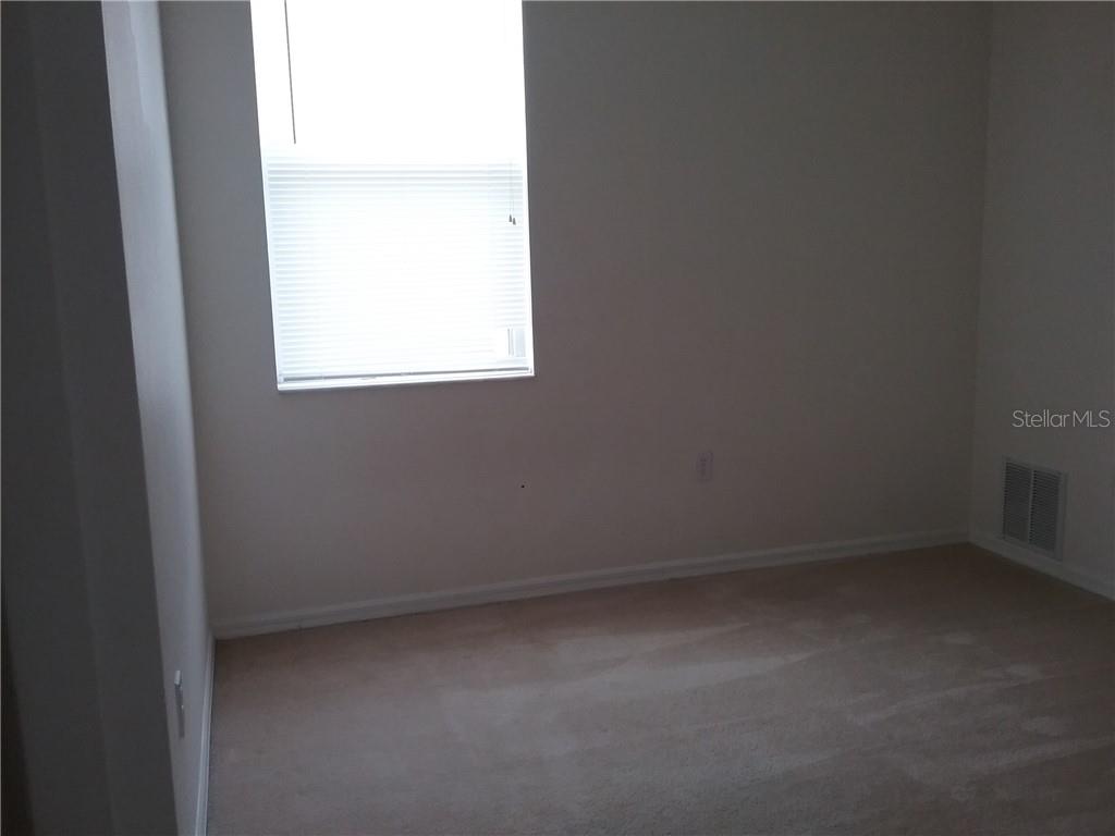 6246 Blue Runner Court Lakewood Ranch, FL 34202 - Photo 9 of 13 a view of a small space with a window