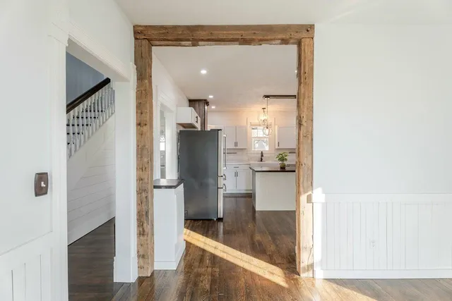a kitchen with stainless steel appliances granite countertop stove a sink and wooden floor