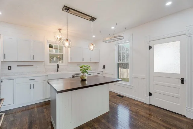 a kitchen with a sink and cabinets