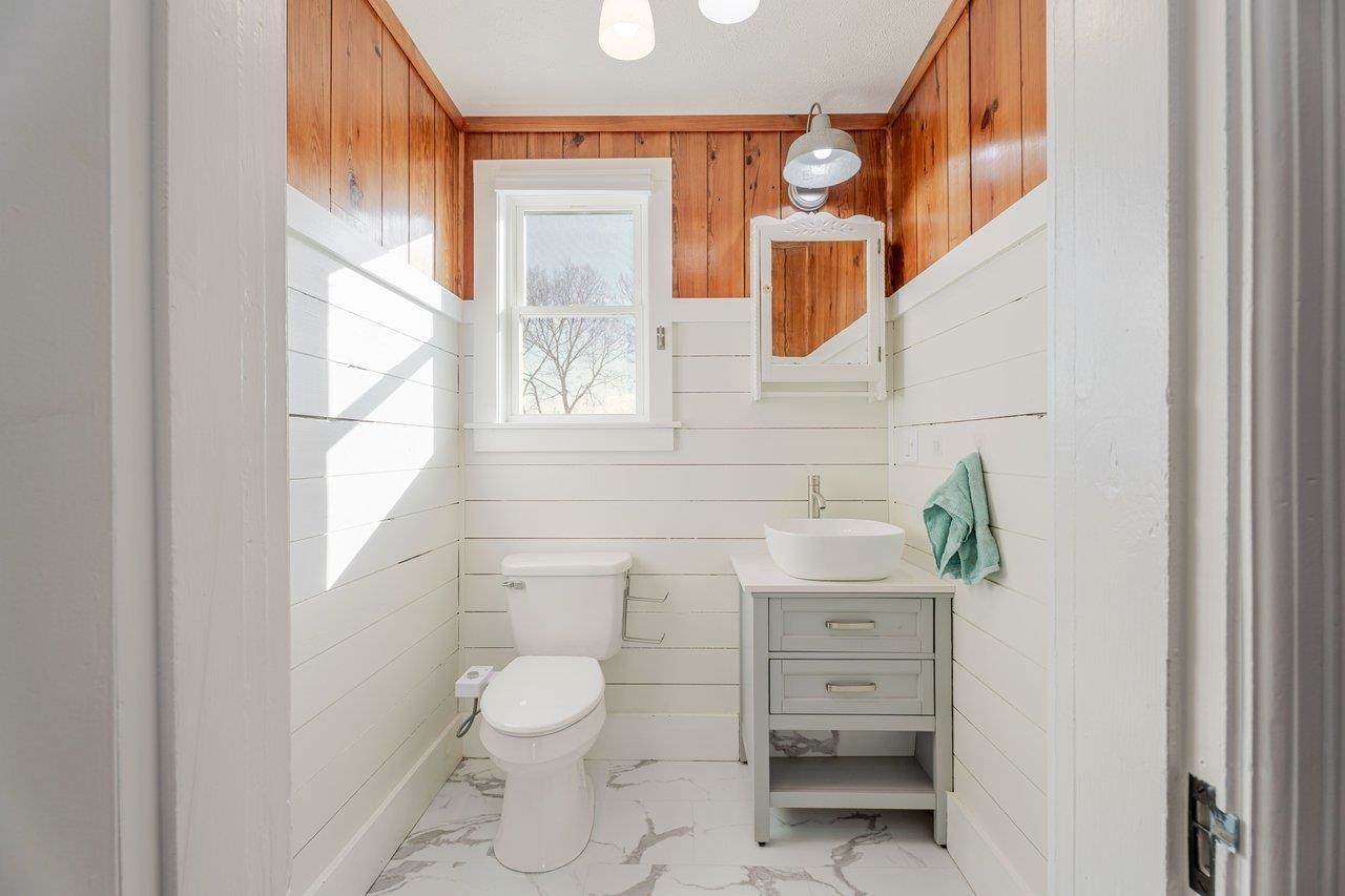 164 Church Street Timberville, VA 22853 - Photo 23 of 68 a bathroom with a toilet sink and mirror