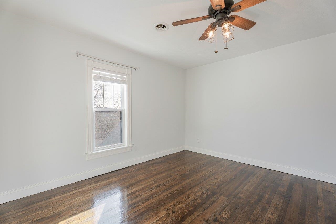 164 Church Street Timberville, VA 22853 - Photo 37 of 68 wooden floor in an empty room with a window