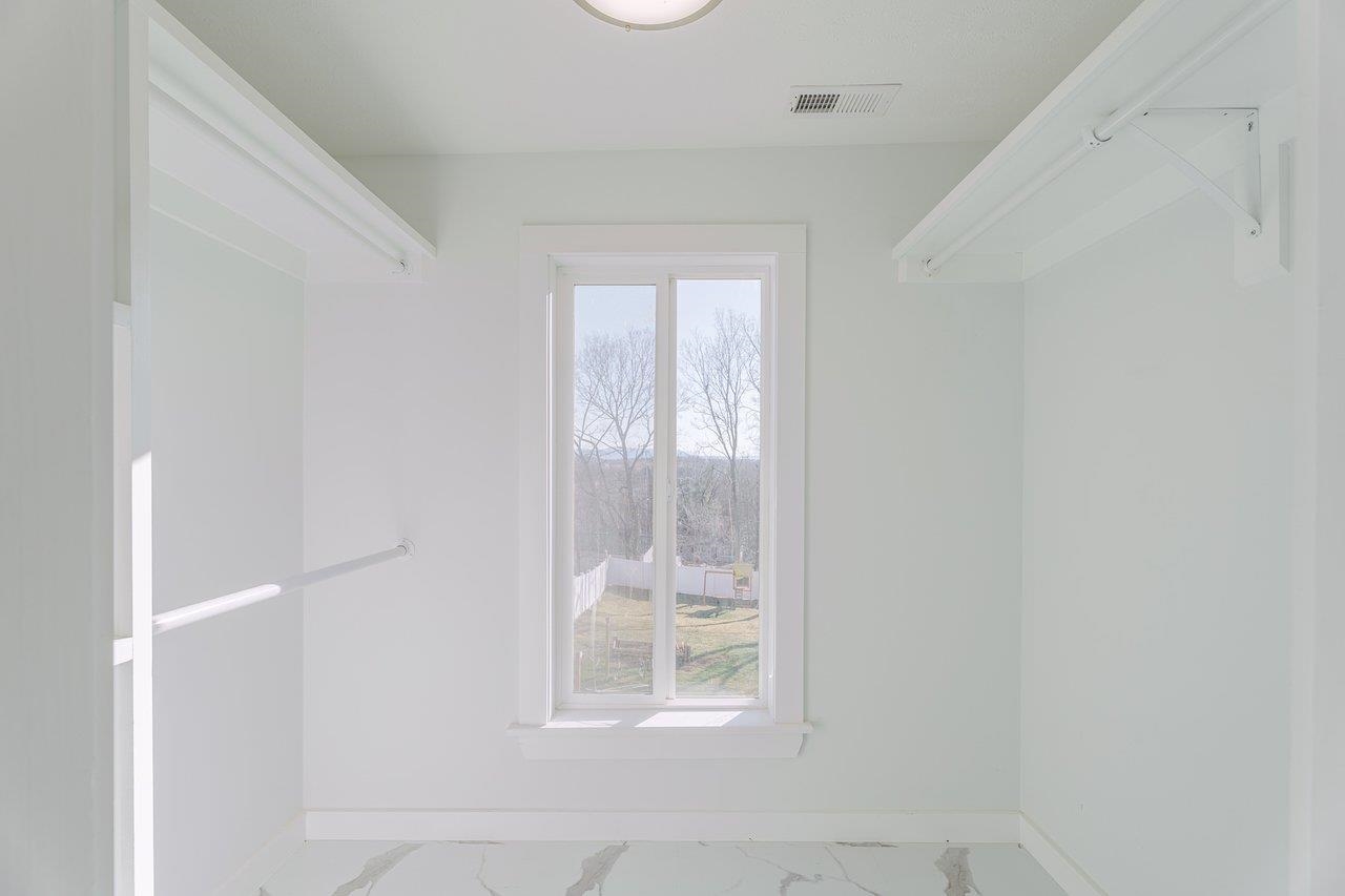 164 Church Street Timberville, VA 22853 - Photo 38 of 68 a view of an empty room with wooden floor and a window